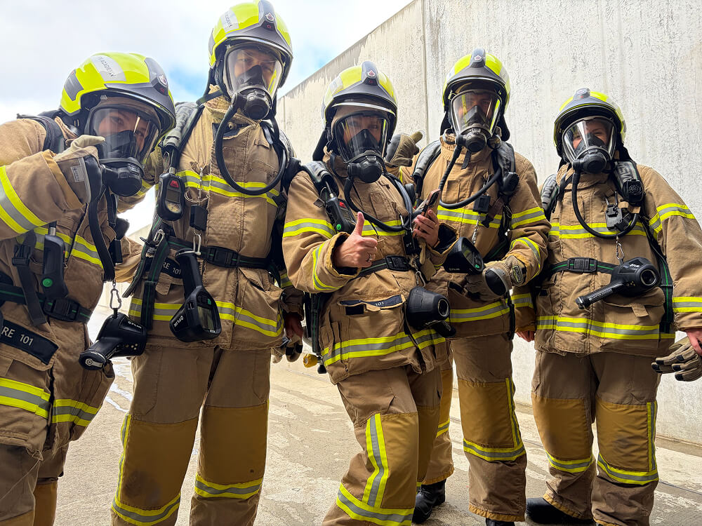 The Cogent team dressed in Fire Rescue gear